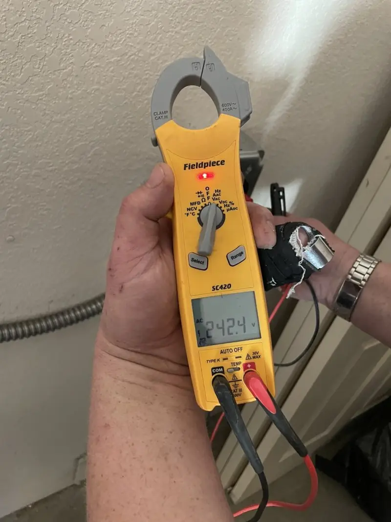 Voltage testing with clamp meter during Electrical Installation Services in Milo